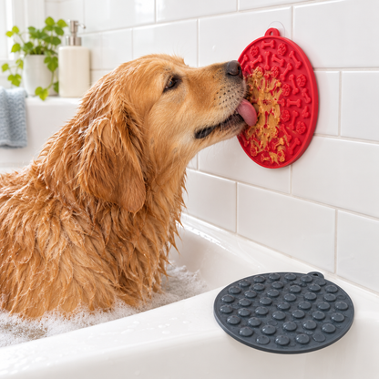 Golden Retriever licking a lick mat stuck to the bath tiles