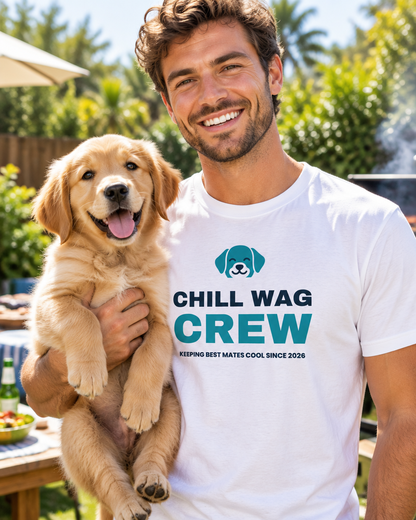 Smiling man in a white Chill Wag Crew tee holding his Golden Retriever puppy at a backyard barbecue (AI-generated image)